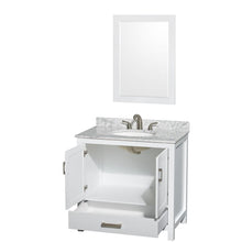 Load image into Gallery viewer, Wyndham Collection Vanity Wyndham Collection WCS141436SWHCMUNOM24 Sheffield 36 Inch Single Bathroom Vanity in White, White Carrara Marble Countertop, Undermount Oval Sink, and 24 Inch Mirror